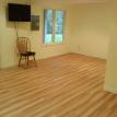 vinyl planked Cherry flooring and wall mount TV, basement remodel