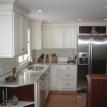 KITCHEN REMODEL ON TORCH LAKE,  CUSTOM CABINETS, STONE TOPS, TILE BACK SPLASH